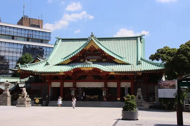 The main hall of Kanda Myojin shrine with its green roof and red pillars
