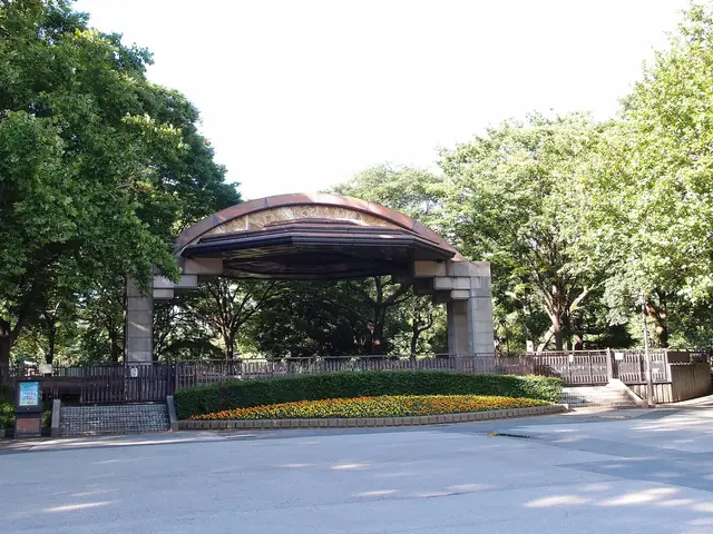The open air bandstand of Hibiya Park among green trees