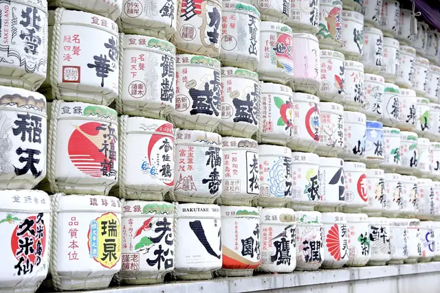 The wall of decorated sake barrels donated by brewers from around Japan at Meiji Jingu
