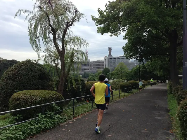 Runners on the path along the moats of the Imperial Palace