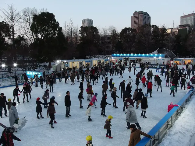 Skaters on the outdoor winter ice rink on the lawn of Tokyo Midtown in Roppongi